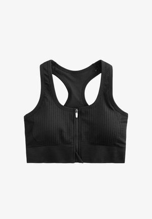 Reggiseno sportivo nero con texture a coste, chiusura frontale con zip e spalline larghe. Il design presenta una scollatura alta e uno stile racerback.