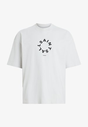 Biely bavlnený tričko s okrúhlym čiernym grafickým potlačou, ktorá zobrazuje text "SAINT LAURENT LONDON" v kruhovom usporiadaní. Krátke rukávy.