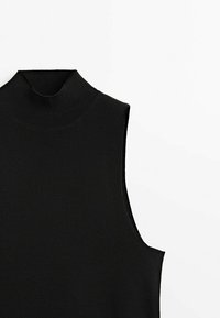 Black sleeveless turtleneck top with a ribbed texture and fitted silhouette, featuring a high collar and open sides for breathability.