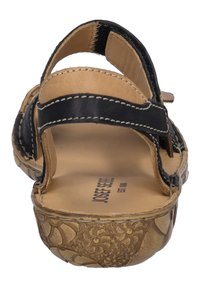 Mustat nahkasaappaat, joissa on avoin varvas, kaksi säädettävää hihnaa ja teksturoitu vaaleanruskea pohja, jossa on kukkakuviota.