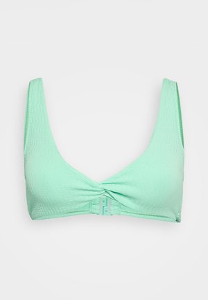 Light mint green bikini top with a textured pattern, wide straps, and a front twist design. Includes a clasp closure at the back.