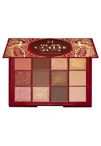 Palette di ombretti rossi con 12 tonalità in finiture opache e shimmer, comprese tonalità di marroni, dorati e rosa. Design dorato intricato sul coperchio.