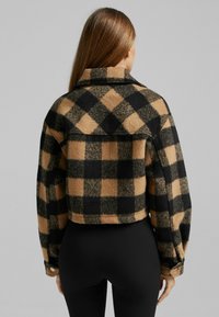 Bershka Tunn jacka - brown