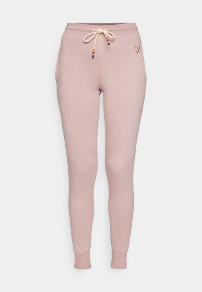 Light pink jogger pants made of soft fabric, featuring an elastic waistband with a drawstring and a small embroidered heart design.