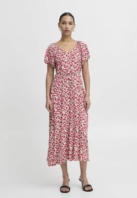 Floral midi dress with short, flutter sleeves, featuring a v-neckline and a drawstring waist. Predominantly white background with pink and green patterns.
