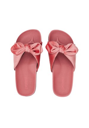 Coppia di sandali rosa in velluto con grandi fiocchi annodati sulla parte superiore, suola piatta e design aperto sulle dita.
