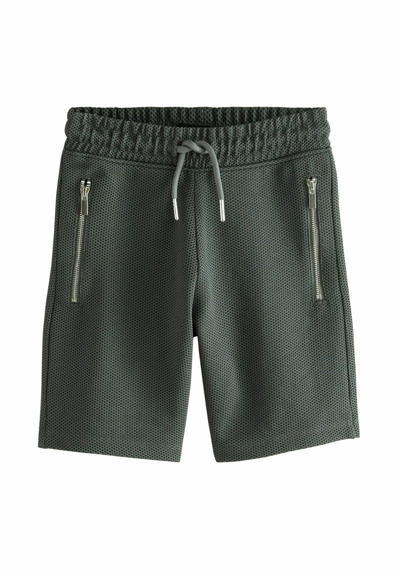 Gröna mesh-shorts med elastisk midja, dragsko och två fickor med dragkedja på sidorna. Texturerat tyg för andningsbar komfort.