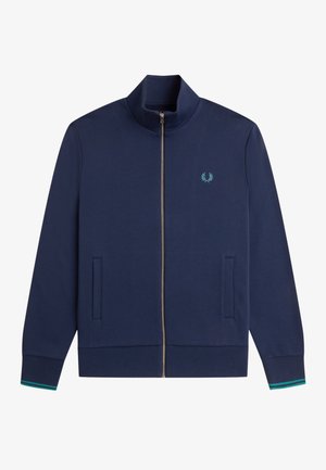 Marineblaue Jacke mit Reißverschluss und Stehkragen, Seitentaschen, gerippten Bündchen mit grünen Streifen und kleinem türkisem Lorbeer-Logo auf der Brust.