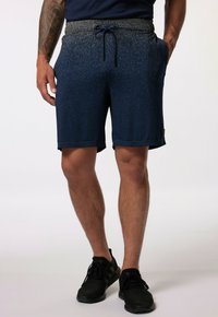 Mørkeblå atletiske shorts med en spraglet tekstur, elastisk talje og justerbar snor. Har sidelommer og et sort mærkeltag.
