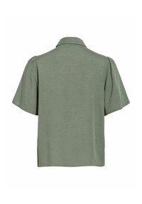 Chemise verte à manches courtes avec col et manches légèrement bouffantes, vue de dos sur fond blanc.