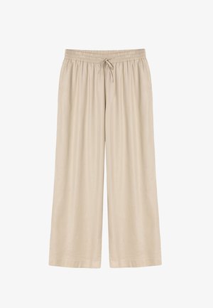 Bézs színű, bő szárú nadrág gumis derékrésszel és megkötővel, könnyű anyagból készült, alkalmas hétköznapi viseletre.