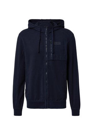 Marineblaues Zip-Hoodie mit einer Fronttasche, verstellbare Kapuze, gerippten Bündchen und glatter Textur. Enthält ein kleines Logo auf der Brust.