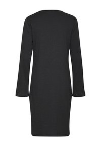 Långärmad klänning i solid svart, med rak passform, rund halsringning och subtilt strukturerad tyg. Bakvy, utan mönster eller dekorationer.