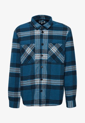 Sinine ruuduline flanellist särk mustade ja valgete detailidega, millel on nööpidega esitulek, krae ja kaks mustriga rinnaülikonda.