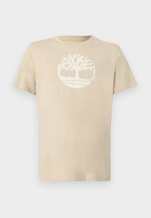 Beige cotton t-shirt with a crew neck, featuring a white tree logo in a circular design. Short sleeves and a standard fit.