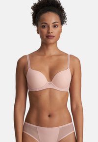 Light pink bra with padded cups, adjustable straps, a smooth texture, and a subtle center triangle detail. No additional patterns or hardware.