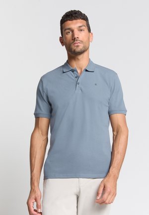 Korte mouwen polo in lichtblauw, gemaakt van zachte katoenstof, met een platte kraag, drie knopen en een subtiele logodetail.