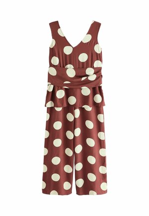 Tuta bordeaux con pois bianchi, scollatura a v, spalline larghe, vita cinchata, design a gamba svasata e tessuto morbido e strutturato.
