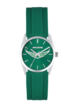 Žalios spalvos laikrodis su sidabriniu korpusu, sidabrinėmis valandų žymėmis, sparnų dizainu ciferblate ir žaliu silikoniniu dirželiu, rodantis laiką 10:09:35.