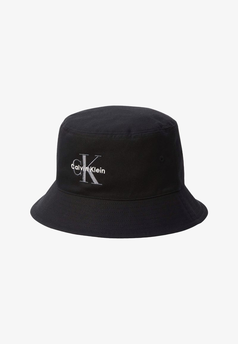 Black bucket hat with embroidered white "Calvin Klein" logo and large "CK" letters on the front.