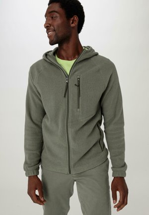 Zachte, olijfgroene fleece hoodie met een frontzipper, twee zijzakken en ribgebreide manchetten. Heeft een lichtgewicht, gestructureerde stof.