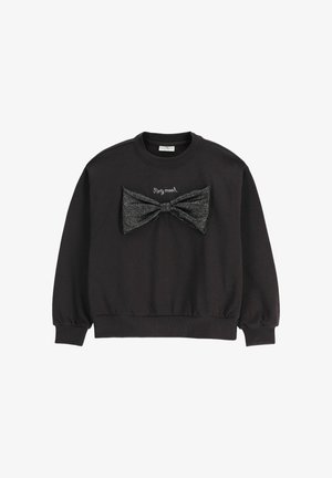 Czarna bluza z długim rękawem z dużą błyszczącą czarną kokardą oraz haftowanym napisem „Party mood” nad kokardą z przodu.