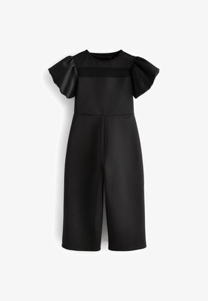 Combinaison noire avec des manches bouffantes courtes, un col rond et un bustier ajusté. Fabriquée dans un tissu lisse avec un design à jambes larges et structurées.