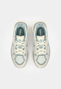 Lightweight sneakers featuring a mesh upper in pale blue and cream, rounded shape, with beige rubber soles and subtle branding accents.