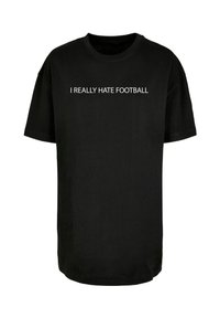 Sort bomulds t-shirt med korte ærmer, der har hvid tekst, som siger "JEG HADER FODBOLD VILDT" centreret på forsiden.
