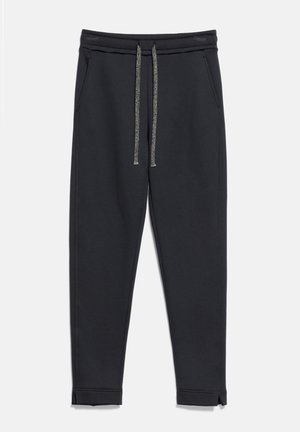 Pantalon de jogging noir fuselé avec taille élastique, deux poches latérales et cordons gris, présenté sur fond blanc.