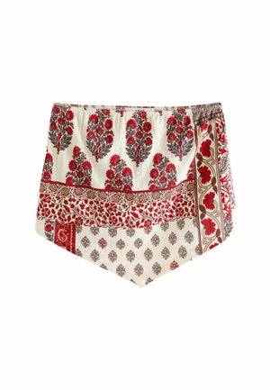 Rote und cremefarbene gemusterte Shorts mit floralen Designs, einem strukturierten Stoff, einem elastischen Bund und einer einzigartigen, kantigen Saumform.
