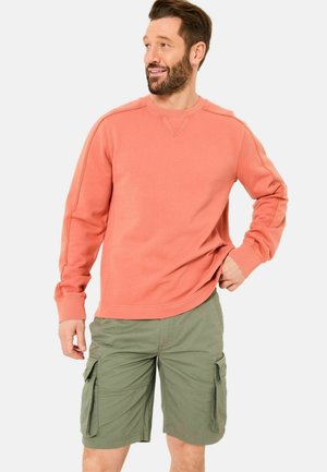 Coral cotton sweatshirt with a crew neck and long sleeves, paired with green cargo shorts featuring side pockets and a relaxed fit.