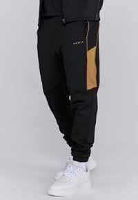 SIKSILK MUSCLE FIT JOGGERS - Tracksuit bottoms - black