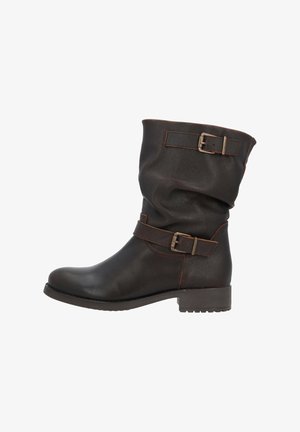 Brown leather ankle boot with a slouchy design, featuring two buckled straps and a low, textured rubber heel.