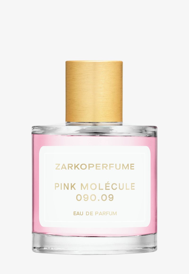 Flacon de parfum en verre transparent avec liquide rose, bouchon doré et étiquette portant la mention Zarkoperfume Pink Molécule 090.09 Eau de Parfum.