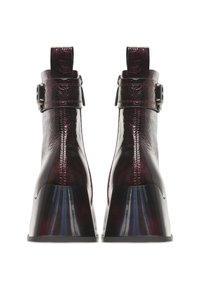 Maroon ankle boots with a glossy patent finish, featuring a textured upper, curved heel, and adjustable buckle accents.