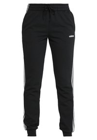 Zwarte sweatpants van zachte stof, met witte zijstrepen en een elastische tailleband met een koord. Adidas-logo op de voorkant.