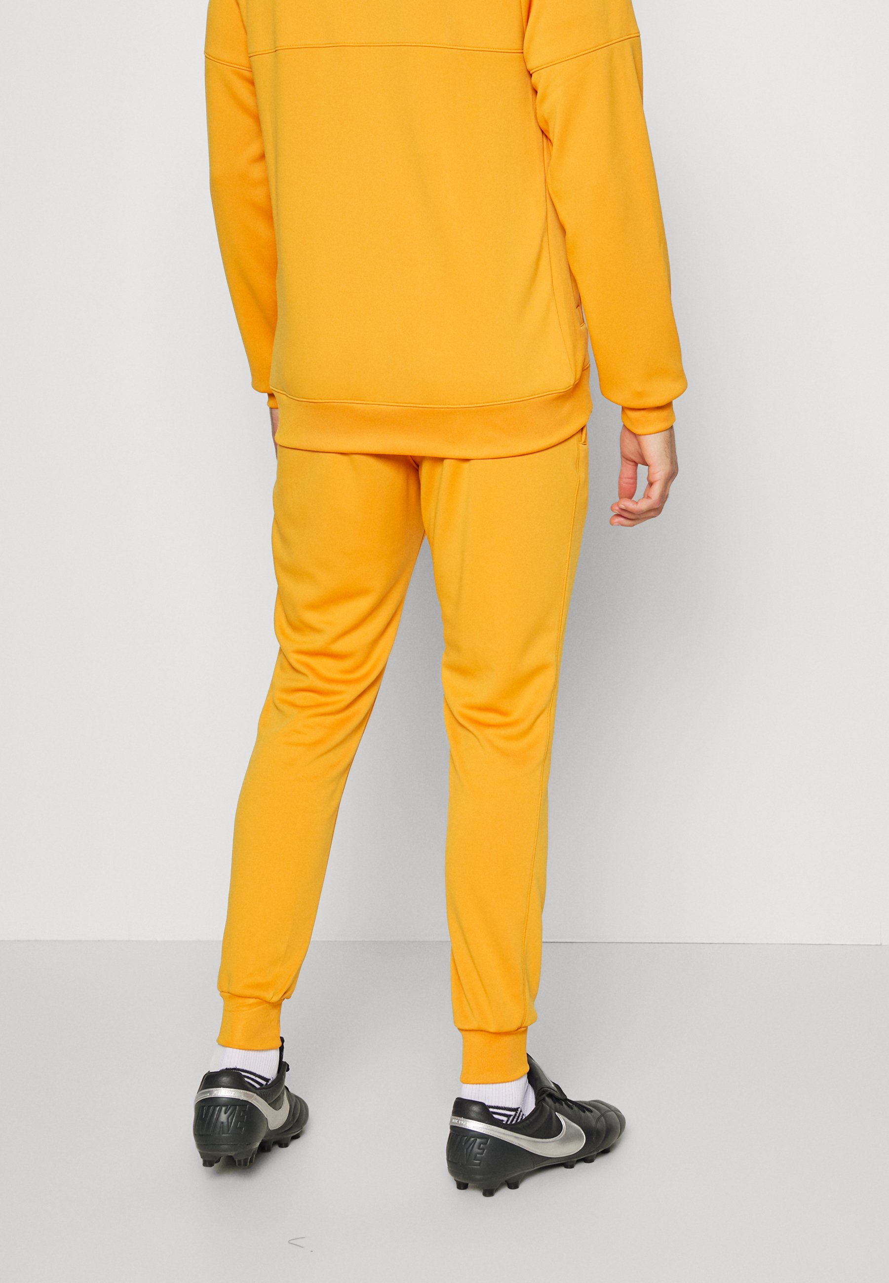 black and yellow nike sweat suit