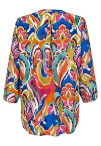 Blouse à manches longues avec des motifs floraux et cachemire abstraits multicolores vifs en bleu, orange, rose, vert et blanc.