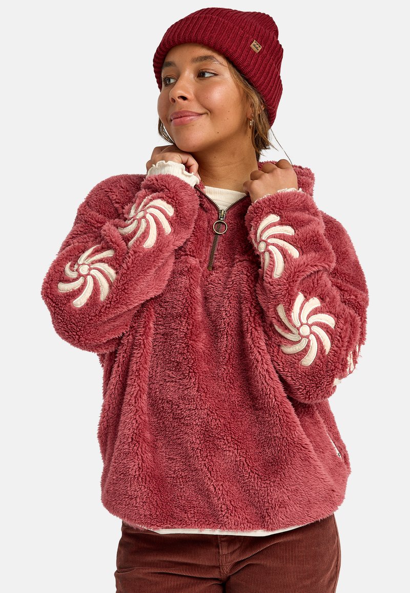 Pullover in pile color bordeaux con ricami crema svolazzanti sulle maniche, zip frontale a mezza lunghezza e tessuto morbido e strutturato.