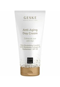 Crème de jour anti-âge GESKE dans un tube blanc avec des accents dorés. Comprend un SPF 20 et met en avant des ingrédients tels que le Ramboutan, le collagène et l'hyaluronane.