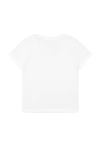 T-shirt bianca a maniche corte con collo rotondo, realizzata in morbido tessuto di cotone. Design semplice senza grafiche o decorazioni.