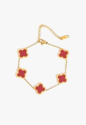 Gold chain bracelet with five red enamel four-leaf clover charms and a lobster clasp with adjustable link chain.