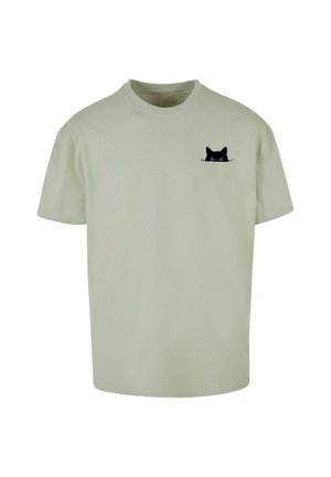 Svetlozelené bavlnené tričko s krátkymi rukávmi, s grafikou čiernej mačky na ľavej hrudnej oblasti. Jednoduchý dizajn s okrúhlym výstrihom.