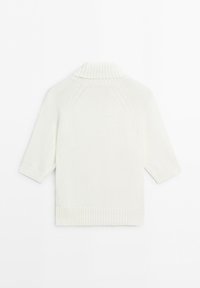 White knitted short-sleeve sweater with high ribbed turtleneck collar and ribbed hem and cuffs shown from the back.
