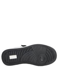 Suola di scarpa in gomma nera con motivo a trama testurizzata, caratterizzata da un accent circolare e da una sezione rettangolare bianca.