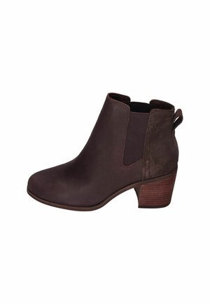 Braune Leder-Stiefelette mit elastischen seitlichen Einsätzen, runder Spitze und gestapeltem Absatz. Mit einem Zugband für einfaches Anziehen.