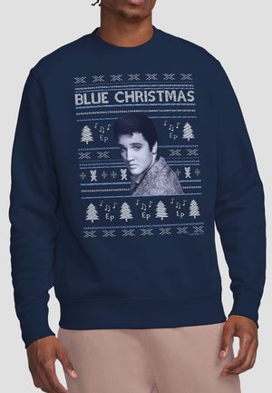 Marineblauer Pullover mit dem Schriftzug "Blue Christmas", einem vintage Elvis Presley-Porträt, weißen Bäumen, Noten und strickmustern mit Feiertagsthema.