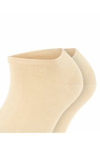 Beige Knöchelsocken mit gerippter Textur und enger Passform. Die oberen Kanten sind glatt und sie verfügen über ein nahtloses Zehendesign.