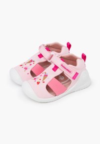Pink canvas children's shoes with white rubber soles, featuring cutouts, elastic straps, and embroidered ice cream designs.